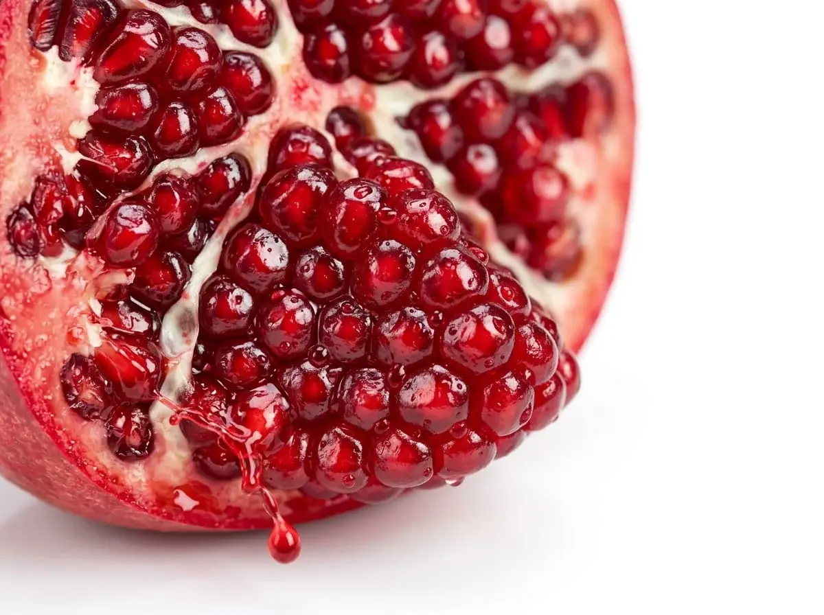 Concentrated red pomegranate arils close-up